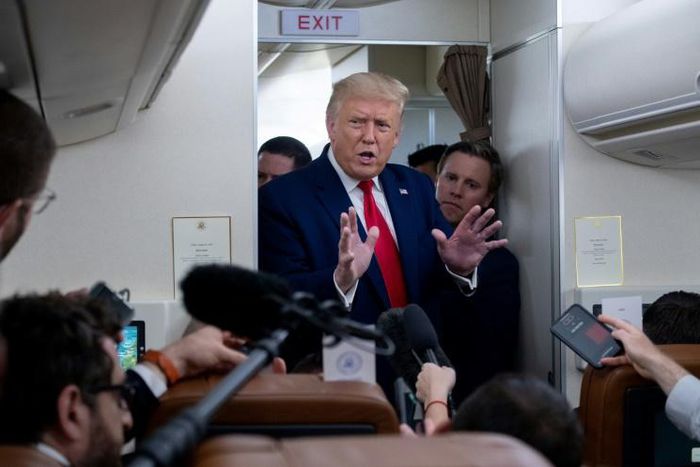 US President Donald Trump speaks with reporters aboard Air Force One on August 28, 2020