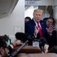 US President Donald Trump speaks with reporters aboard Air Force One on August 28, 2020