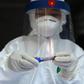 Medical workers took blood samples and mouth swabs at a makeshift testing centre in Hanoi