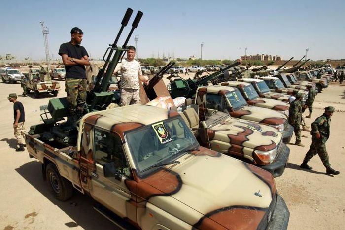 In this photo taken on June 18, 2020, pro-Haftar forces gather in the eastern city of Benghazi, reportedly on their way to back up fighters near the city of Sirte