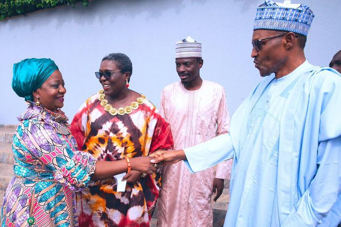 President Muhammadu Buhari (right) shakes hands with his media aide, Lauretta Onochie [Twitter/@BuhariMediaORG]