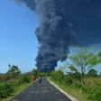 The explosion sent bright orange flames and huge, black plumes of smoke high into the sky