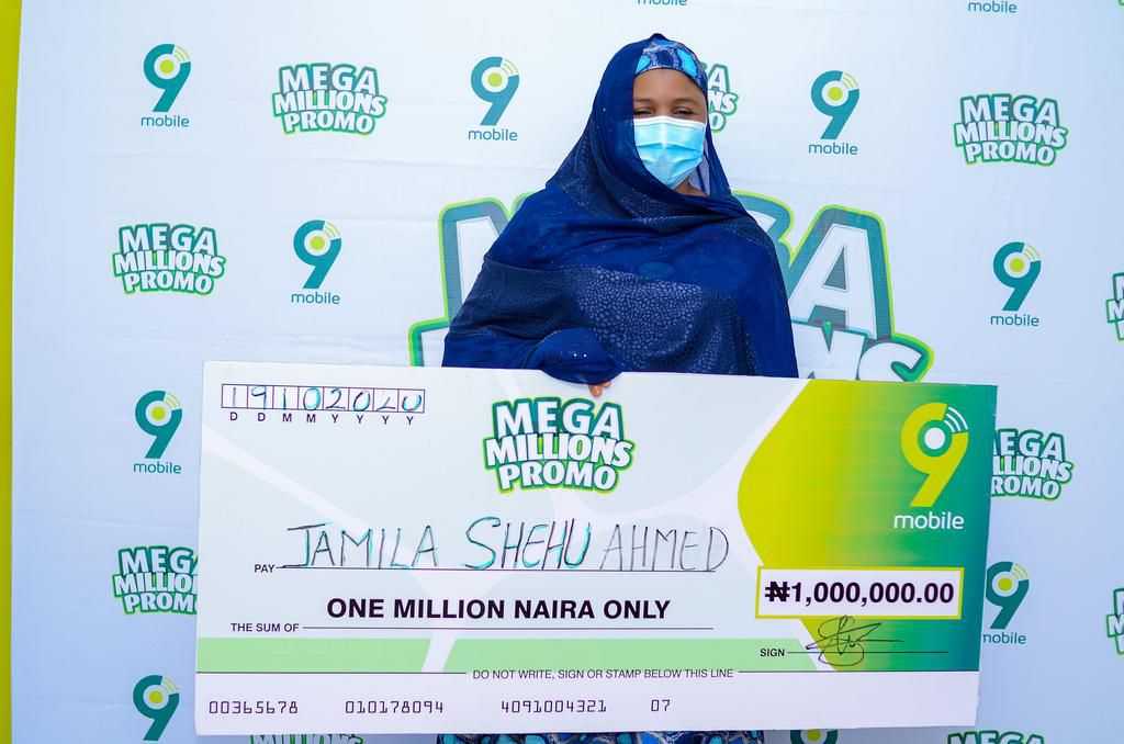 Jamila Shehu Ahmed, 1million Naira winner in the ongoing 9mobile Mega Millions Promo prize presentation in Kano
