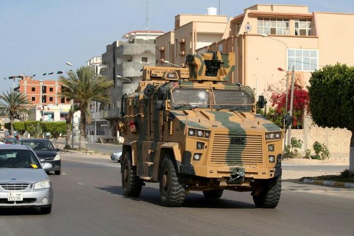 A file photo from June 2019 shows fighters loyal to the UN-recognised Government of National Accord (GNA) open tank fire south of the Libyan capital Tripoli during clashes with forces loyal to strongman Khalifa Haftar