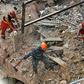 Rescue workers dig through the rubble of a badly damaged building in Lebanon's capital Beirut in search of a possible survivor from a mega-blast at the adjacent port one month ago, after scanners detected a pulse, on September 4, 2020