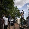 Protesters at a barricade erected in front of the Salam Mosque in Bamako, where Imam Mahmoud Dicko, a leader of the anti-government movement, led prayers on Sunday for victims of the clashes
