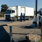 Police ask for travel documents at a road block in Mbare, a township in the suburbs of Harare