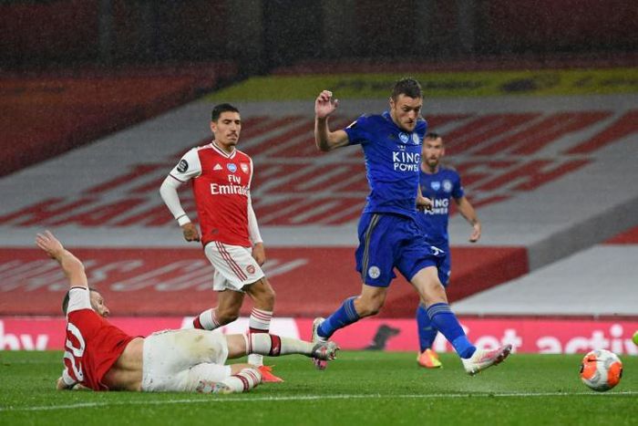 Fox in the box: Jamie Vardy (centre)salvaged a point for Leicester at Arsenal