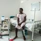 Jonel Cadet, 25, sits in his rehab room at the Doctors Without Borders hospital in Cite Soleil -- if not for his motorcycle accident, he would not have discovered he had COVID-19