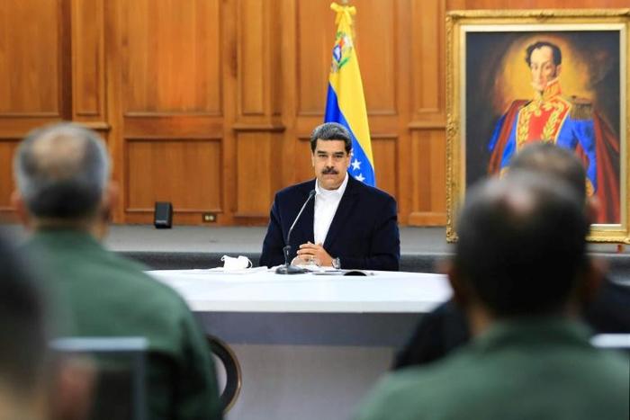 President Nicolas Maduro, shown in a handout picture released by the Venezuelan Presidency speaking to members of the Bolivarian National Armed Forces (FANB), announced that two Americans were arrested for taking part in the failed "invasion"