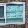A sign is seen pasted on a window at one of nine public housing estates locked down due to a spike in COVID-19 coronavirus numbers in Melbourne