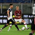 AC Milan's Simon Kjaer challenges Juventus forward Cristiano Ronaldo (L) at the San Siro on July 7, 2020.
