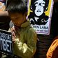 Protesters hold pictures of the missing Panchen Lama recognized by the Dalai Lama in a 2013 demonstration outside the Chinese consulate in Barcelona