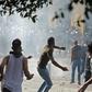Lebanese protesters hurl rocks towards security forces during clashes in downtown Beirut
