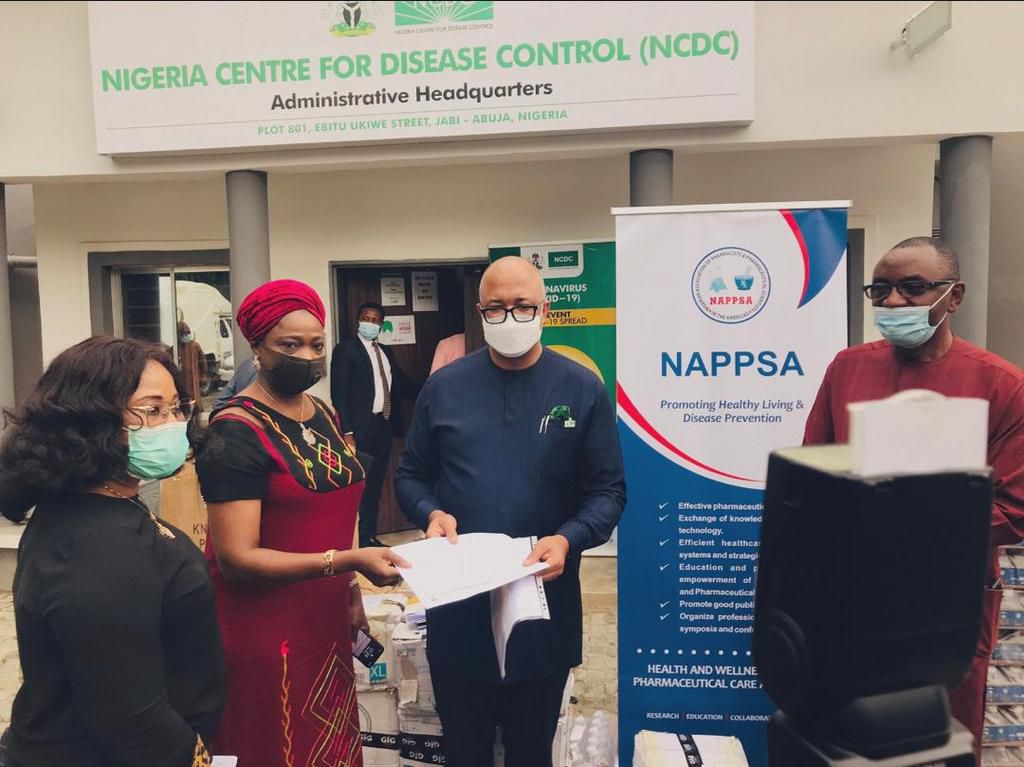 Chairman/CEO of the NiDCOM Mrs Abike Dabiri-Erewa (second from left) at the presentation of Diagnostics and Pharmaceutical Personal Protective Equipment worth millions of Naira by the Nigerian Association of Pharmacists and Pharmaceutical Scientists in...
