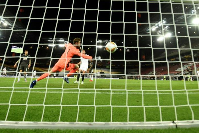 All over: Sevilla's Luuk De Jong scores past Manchester United goalkeeper David de Gea