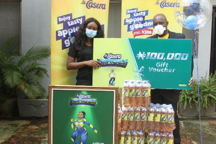 L-R: Brown Knight; Dr Ola Brown and Managing Director, The La Casera Company Mr. Chinedum Okereke at the gift presentation in Lagos State.