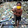 A boy wears a face mask in the Brazilian city of Manaus on May 26, 2020. Brazil has become a new global epicenter of the coronavirus pandemic in recent days