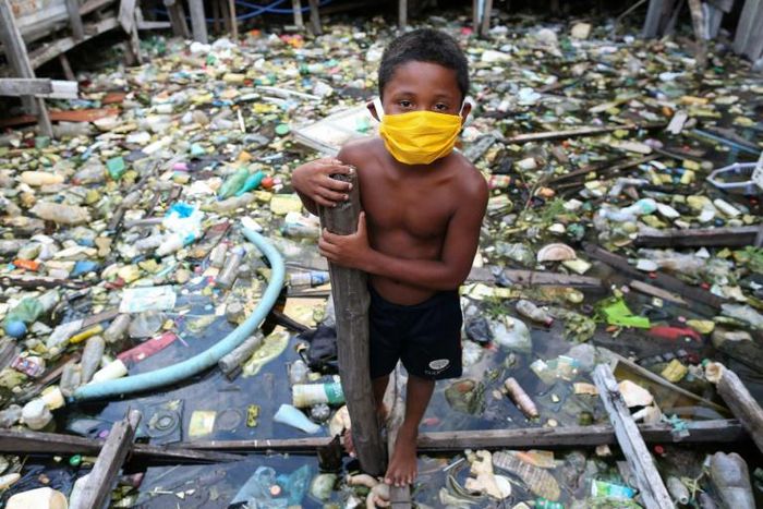 A boy wears a face mask in the Brazilian city of Manaus on May 26, 2020. Brazil has become a new global epicenter of the coronavirus pandemic in recent days