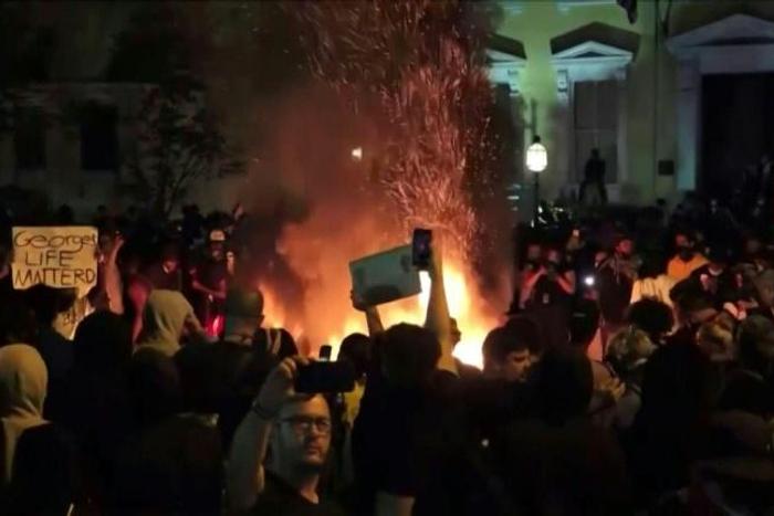 Crowds of protesters break curfew in Washington to demonstrate near the White House