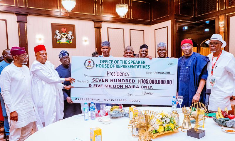President Bola Tinubu receiving the donation from the leadership of the House of Representatives. [X, formerly Twitter]
