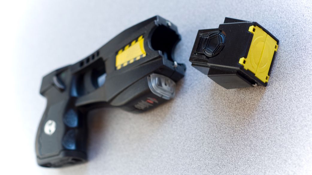 Black taser (stun gun) with part unattached. [Stock Photo/Getty Images]