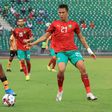 Zachariah Chilongoshi (L) of Zambia controls the ball as Soufiane Rahimi (R) of Morocco closes in during an African Nations Championship quarter-final in Douala Sunday.