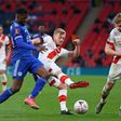 Nigerian Kelechi Iheanacho (L) of Leicester City takes on two Southampton players.