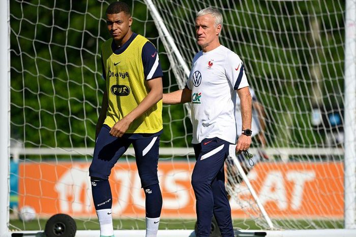 France striker Kylian Mbappe (L) and coach Didier Deschamps (R) prepare for Tuesday's Euro 2020 clash with Germany