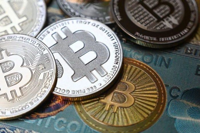 Bitcoin crypto currency physical banknote and coin imitations.