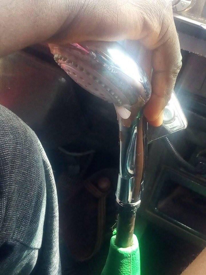 Trotro driver uses showerhead as a gear stick knob for the rickety vehicle