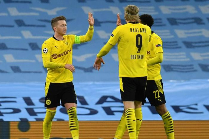 Borussia Dortmund captain Marco Reus (L) celebrates his goal at Manchester City in Tuesday's 2-1 away defeat