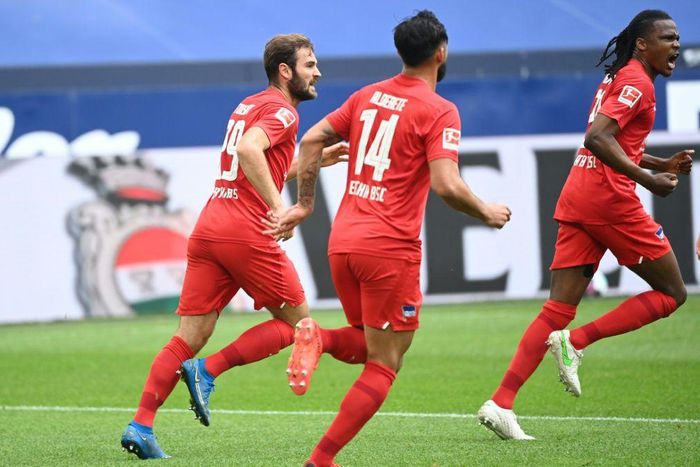Belgium defender Dedryck Boyata (R) celebrates scoring Hertha Berlin's equaliser at Schalke on Wednesday
