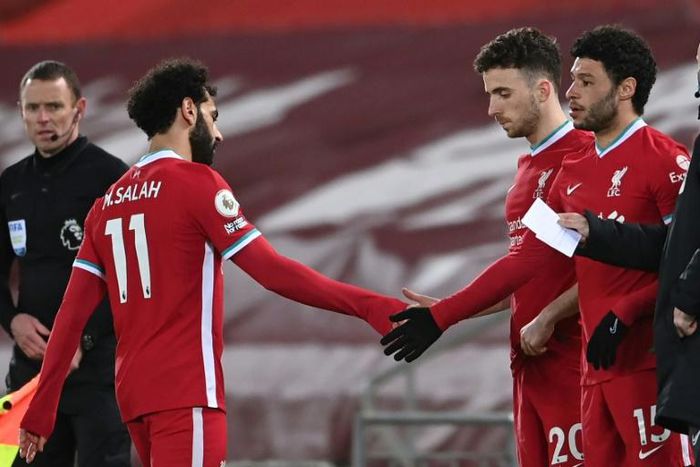 Mohamed Salah (left) is substituted during the English Premier League football match between Liverpool and Chelsea