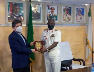 FOC, NAVTRAC, Rear Adm. Kamarudeen Lawal presenting a plaque of honour to Mr Marceleno Ansorena. [NAN]
