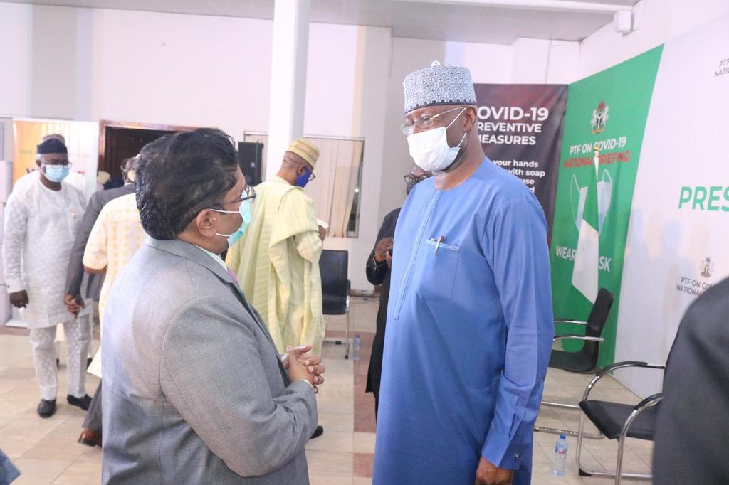 Chairman of the Presidential Task Force (PTF) on COVID-19 and Secretary to the Government of the Federation, Boss Mustapha receives the 100,000 doses of Covishield Vaccines from the Indian High Commissioner to Nigeria, Mr Velagaleti Surendra. [Twitter/...