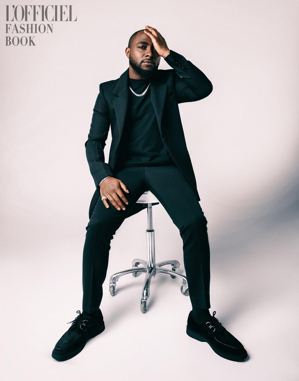 Davido for L'Officiel wearing Cardigan by Dries Van Noten, T-shirt by Salvatore Ferragamo, Trousers by Ungaro, Shoes by Giuseppe Zanotti, Jewelry is Davido’s own [L'Officiel]