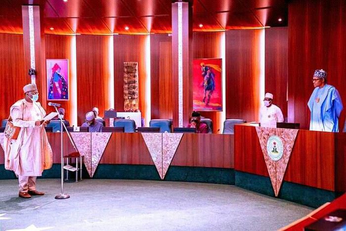 President Muhammadu Buhari swears in INEC Boss Mahmood Yakubu for second term. [Twitter/@tukurabdu36]