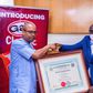L-R: Dr Oladele Ajayi, MD/CEO, UAC Foods LTD receiving the Halal certification for the company's flagship sausage roll brand, Gala, from Abdulazeez Ajala, Lead Auditor, Halal Certification Authority in Nigeria.