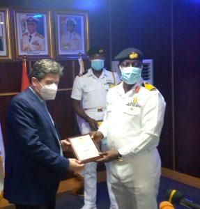 FOC, Western Naval Command, Rear Adm. Jason Gbassa presenting a plaque of honour to Spanish Ambassador to Nigeria, Mr Marceleno Ansorena. [NAN]