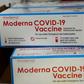 Boxes containing the Moderna COVID-19 vaccine are prepared to be shipped.