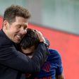 Atletico Madrid coach Diego Simeone hugs Angel Correa at the end of the game