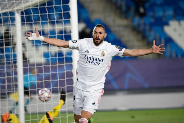 Karim Benzema's brace sent record 13-time winners Real Madrid through to the last 16 of the Champions League
