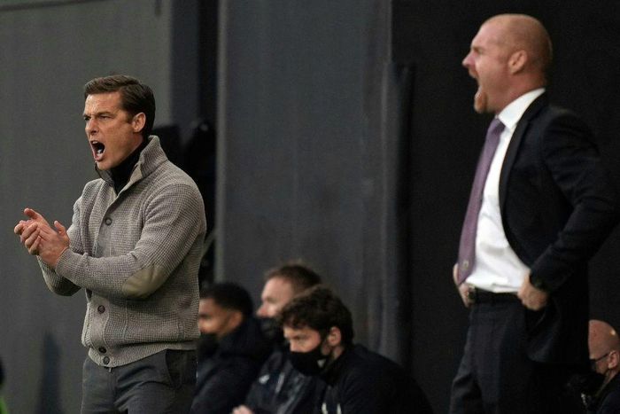 Going down, staying up - Rival managers Scott Parker (Fulham, L) and and Sean Dyche (Burnley R) urge their sides on during a x-x win for Burnley that saw Fulham relegated from the Premier League