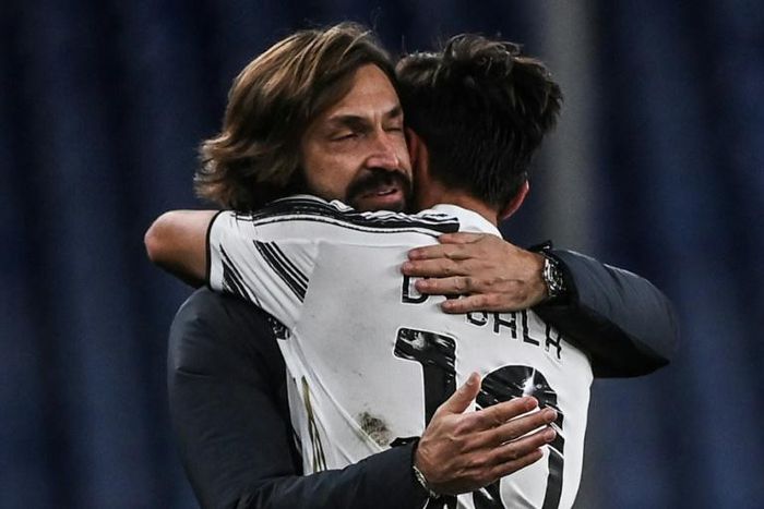 Dybala celebrates with coach Andrea Pirlo (L) after scoring his first league goal in five months