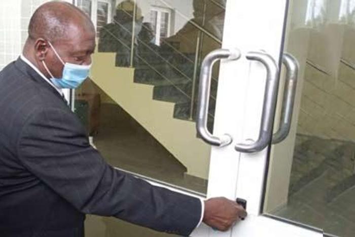 The Lagos CJ, Justice Kazeem Alogba, opening the door to the newly built Osbourne Courthouse on Thursday