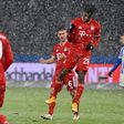All go in the snow: Bayern Munich's Kingsley Coman celebrates scoring