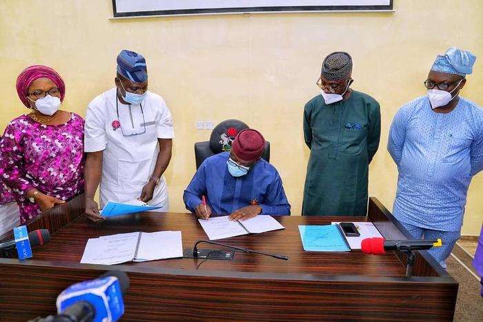 Governor Kayode Fayemi signs 2021 budget into law, promises full implementation. [Twitter/@kfayemi]