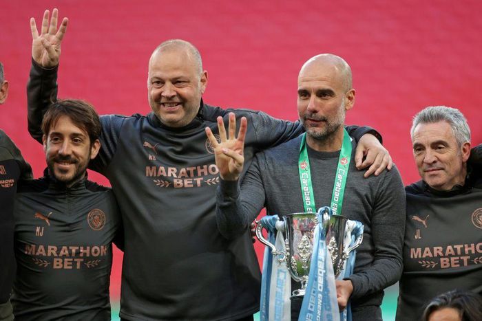 Manchester City manager Pep Guardiola (2nd R) and his coaches