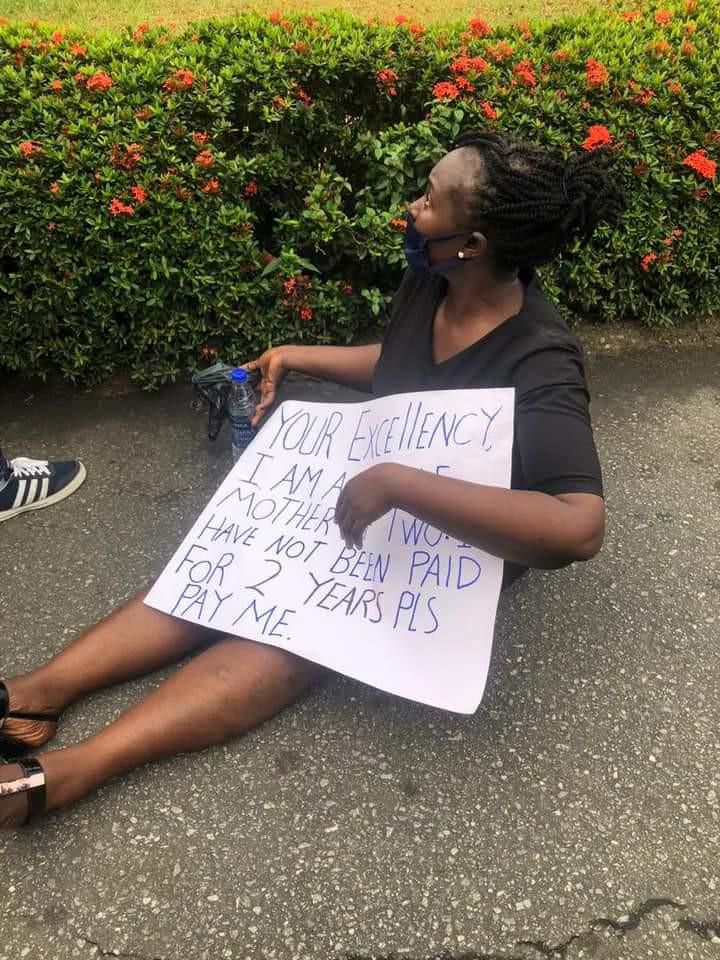 Nigerian magistrate & 2 sons protest over her 2 years' salary arrears